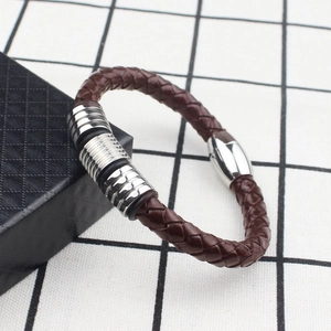 Men's dark brown woven leather bracelet with polished magnetic steel clasp and rings