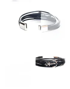 Detail of multi-layer black braided leather bracelet with silver anchor charm and clasp