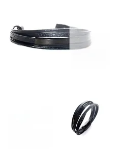 Macro detail of multi-layered braided leather bracelet with matte black magnetic clasp