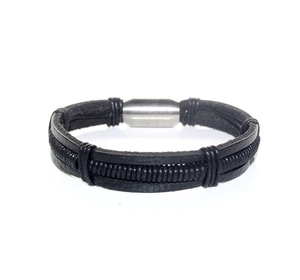Detail of multi-layer black braided leather bracelet for men with silver magnetic clasp