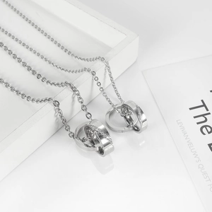 Detail of silver interlocked double ring necklace with cubic zirconia micro-pave setting