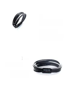 Close-up of black multilayer braided leather bracelet with black magnetic clasp