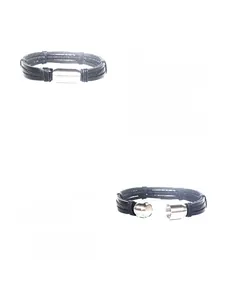 Detail view of multi-layer braided leather bracelet featuring cylindrical magnetic clasp
