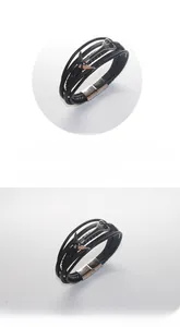 Vue détaillée du bracelet multicouche en cuir tressé noir avec ancre argentée et fermoir aimanté