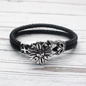 Men's black woven leather bracelet featuring gothic punk metal flowers and cross details