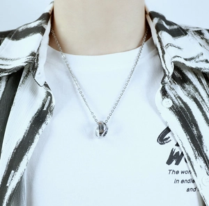 Detailed view of silver interlocking ring pendant engraved with LOVE and never on a chain