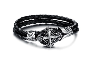 Macro detail of men's leather bracelet with micro-paved zircon cross and Greek key pattern
