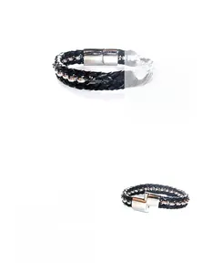 Detail of black woven leather bracelet with silver beads and polished magnetic clasp