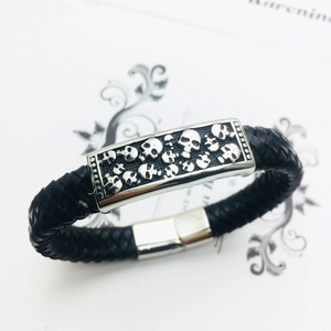Punk rock braided leather bracelet with engraved skull metal plate and silver buckle