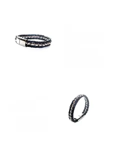 Macro shot of black braided leather bracelet featuring silver metal bead accents