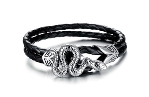 Macro shot of silver snake clasp and woven black leather texture on a men's bracelet