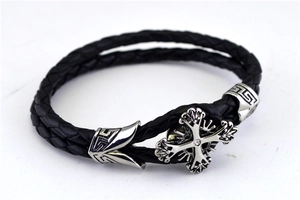 Detail of double-layer woven leather bracelet with zircon cross and Greek key pattern