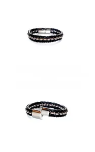 Detail of black woven leather men's bracelet featuring polished steel beads and clasp