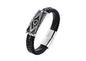 Close-up of Masonic emblem and polished magnetic clasp on black braided leather bracelet