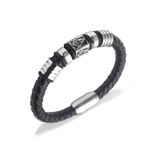 Macro shot of a braided leather bracelet with a silver Masonic Freemasonry square symbol