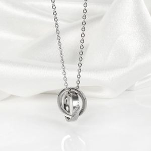 Minimalist silver double interlocking rings necklace with sparkling crystals on a chain