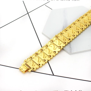 Men's bold 18K gold plated dragon pattern link bracelet with a secure fold-over clasp