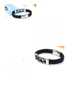 Detail of men's black braided leather bracelet featuring stainless steel Cuban chain link