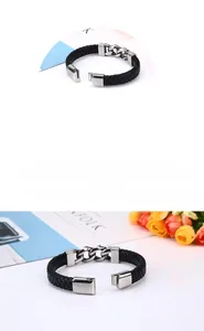 Close-up of men's black braided leather bracelet with silver chain and metal buckle