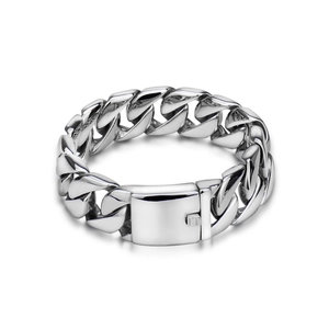 Detailed view of the thick Cuban chain links and secure box clasp on silver steel bracelet