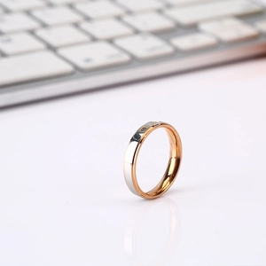 Minimalist titanium steel ring with silver and rose gold split design and black square stone