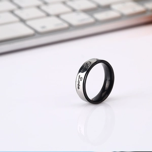 Minimalist silver and black titanium steel couple ring with engraved Love script design