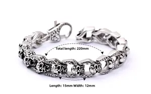 Detailed view of vintage silver punk skull links and lobster clasp on steel bracelet