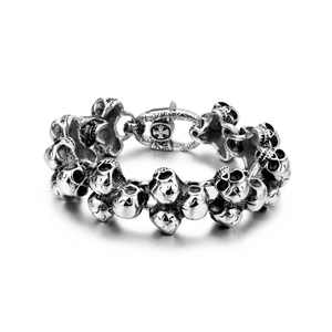 Macro shot of punk style stainless steel skull bracelet with vintage blackened details