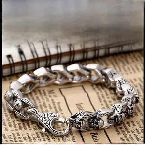 Detailed close-up of retro punk skull bracelet links in aged titanium steel finish
