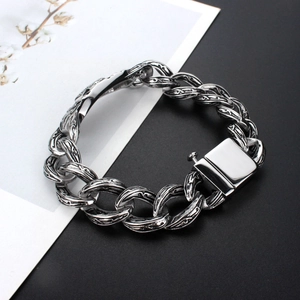 Vintage titanium steel chain bracelet with intricate cross scroll texture and industrial clasp