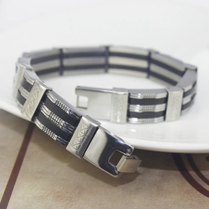 Close-up of men's industrial style bracelet with stainless steel hinges and black silicone