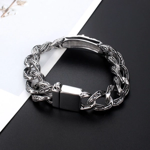 Retro titanium steel chain bracelet with cross totem engraving on a bicolor background