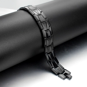 Polished black titanium steel link bracelet with folding clasp for men on display