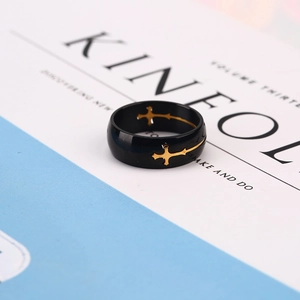 Minimalist black stainless steel ring with polished golden cross inlay for men