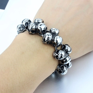 Punk vintage stainless steel skull link bracelet for men shown on a male wrist