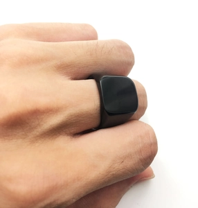 Close-up of a men's polished black square signet ring made of durable stainless steel