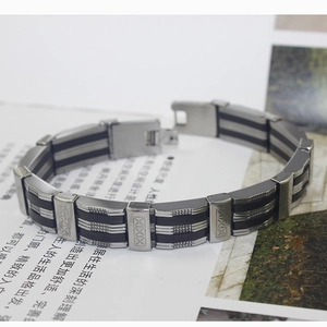Detail view of men's silicone steel bracelet with geometric patterns and secure fold clasp