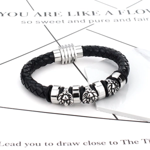 Vintage men's braided black leather bracelet with three silver lion head charms