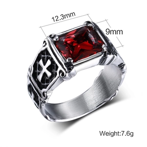 Macro detail of men's silver ring with red stone showing precise 12.3mm by 9mm dimensions