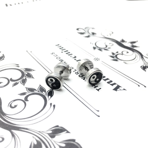 Pair of stainless steel Yin Yang stud earrings with polished silver finish and screw back