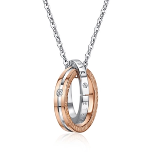 Detail of interlocking double rings necklace with sparkling stones and romantic engraving
