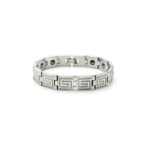Detailed view of silver titanium steel bracelet with Greek key pattern and black magnets