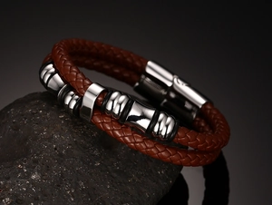 Close-up of double-layer reddish brown braided leather bracelet with silver magnetic clasp
