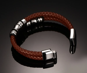 Close-up of double-strand braided reddish brown leather bracelet with magnetic clasp