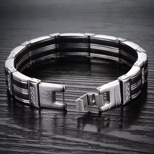 Men's wide titanium steel bracelet with black silicone inlay and geometric textures