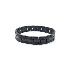 Détail macro du bracelet magnétique noir pour hommes avec aimants de santé bicolores