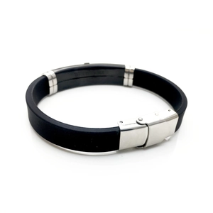Detail view of men's silicone bracelet with polished stainless steel clasp and accents