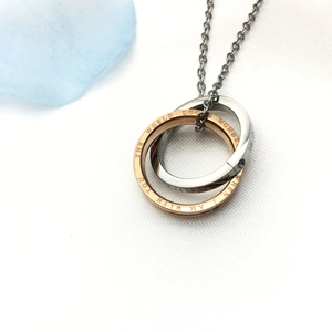 Modern double interlocking ring pendant necklace in rose gold and silver stainless steel