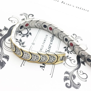 Mens titanium steel magnetic therapy bracelet with gold and silver links and dotted texture