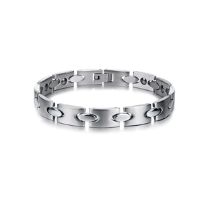 Detailed close-up of a titanium steel magnetic therapy bracelet with brushed metal finish